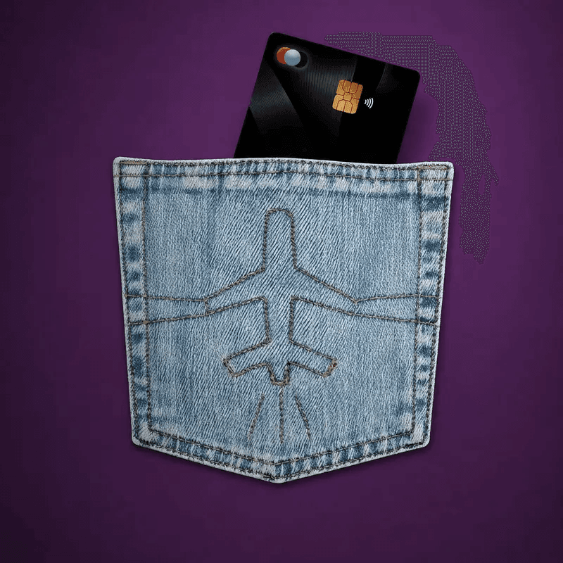 A Bl!nk card in the back pocket of jeans stitched with an aeroplane